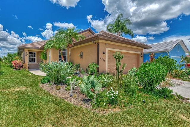 ranch-style home with a garage and a front yard