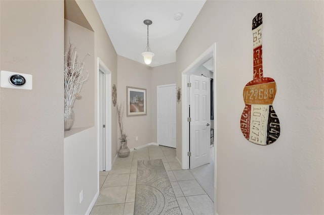 corridor with light tile patterned floors