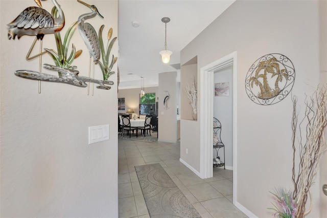 hallway with light tile patterned floors