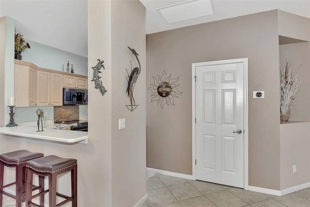 foyer featuring light tile patterned flooring