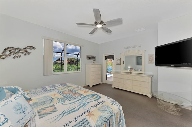 bedroom with ceiling fan and dark colored carpet