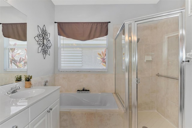 bathroom with separate shower and tub and vanity