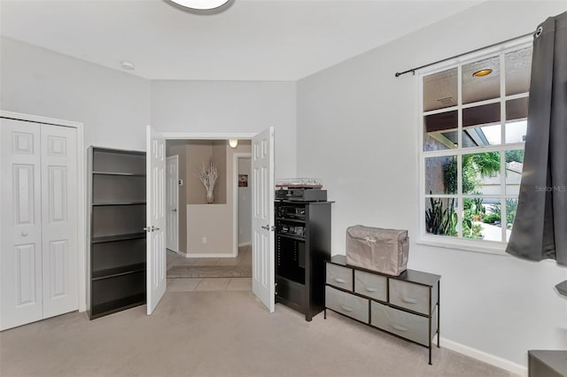 carpeted bedroom featuring a closet