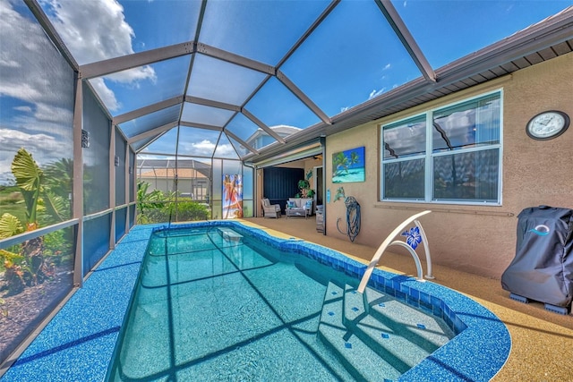 view of pool featuring a lanai and a patio