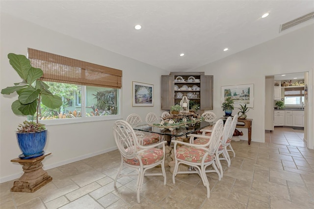 dining area with lofted ceiling