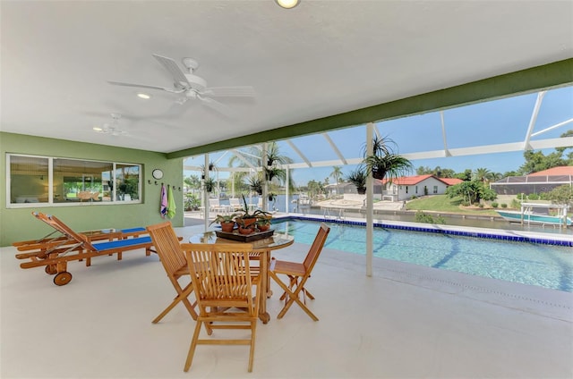 view of swimming pool with ceiling fan