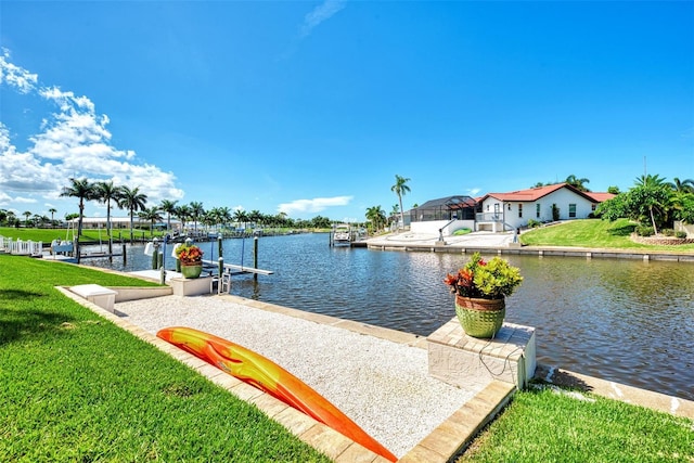 dock area featuring a yard and a water view