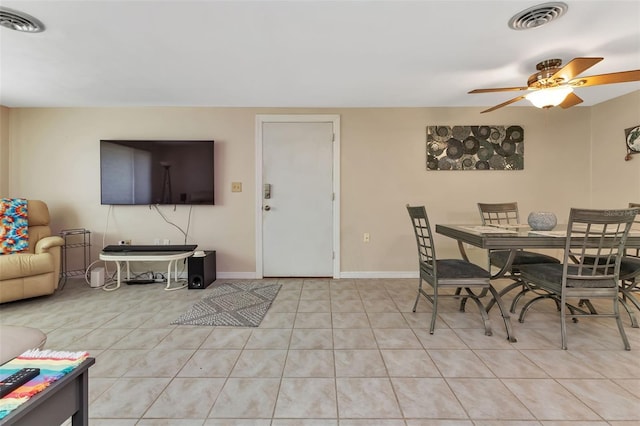 dining space featuring ceiling fan and light tile patterned flooring