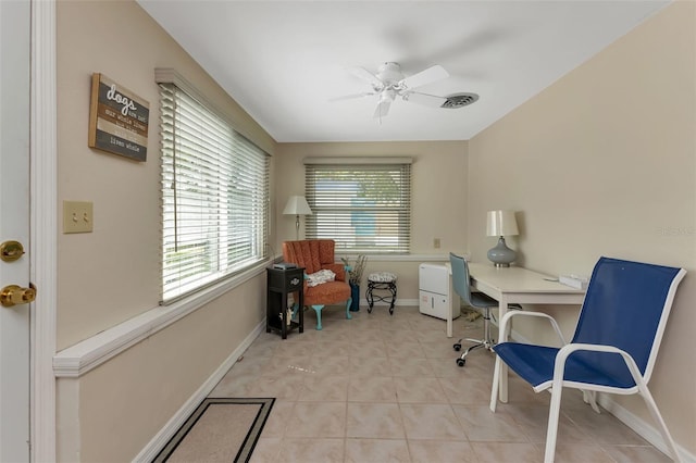 tiled office space with ceiling fan