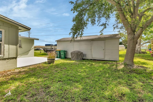 view of yard featuring a shed and a patio