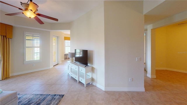 living room with light tile patterned flooring and ceiling fan