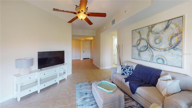 tiled living room featuring ceiling fan