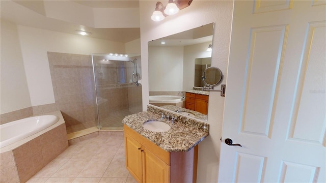 bathroom with tile patterned flooring, dual vanity, and plus walk in shower