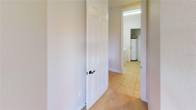 hallway featuring light tile patterned floors