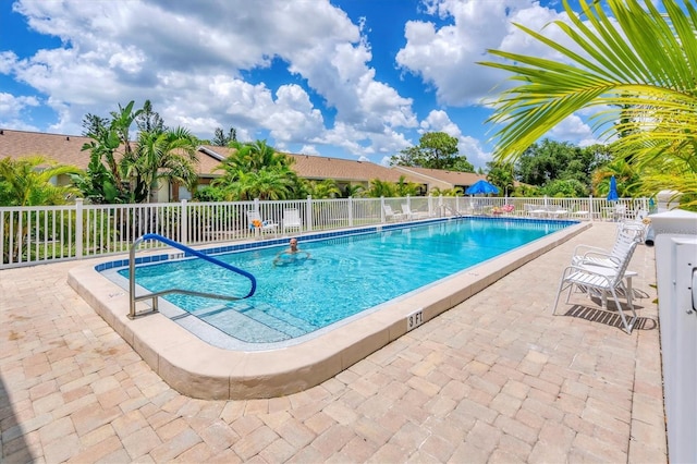 view of pool featuring a patio