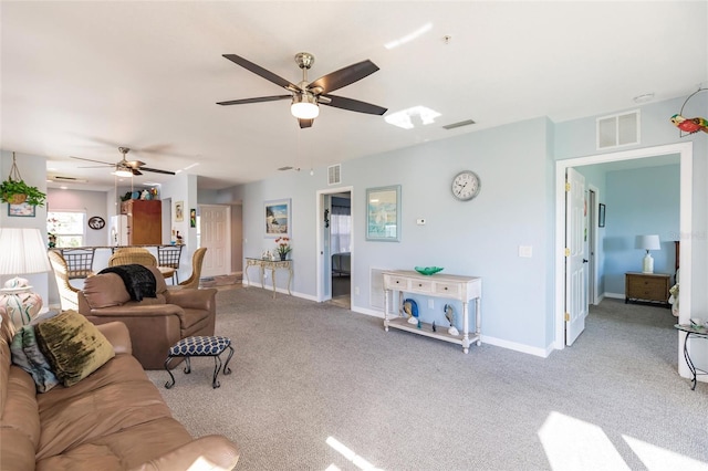 carpeted living room featuring ceiling fan