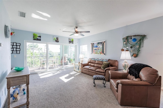 living room with carpet flooring and ceiling fan