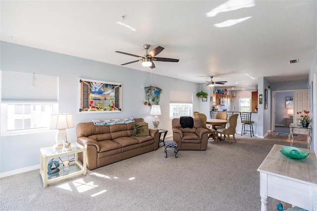 living room with light carpet and ceiling fan