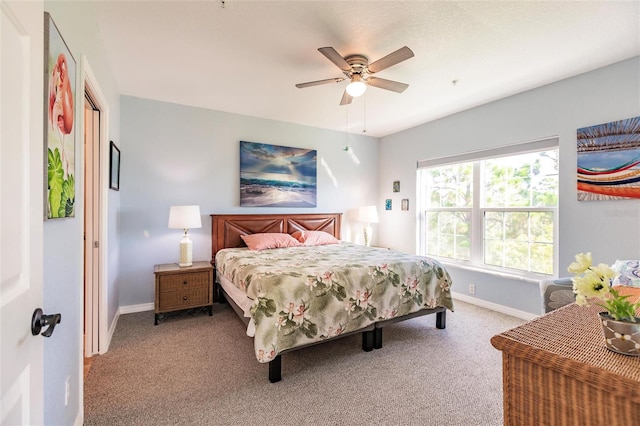 bedroom featuring light colored carpet and ceiling fan