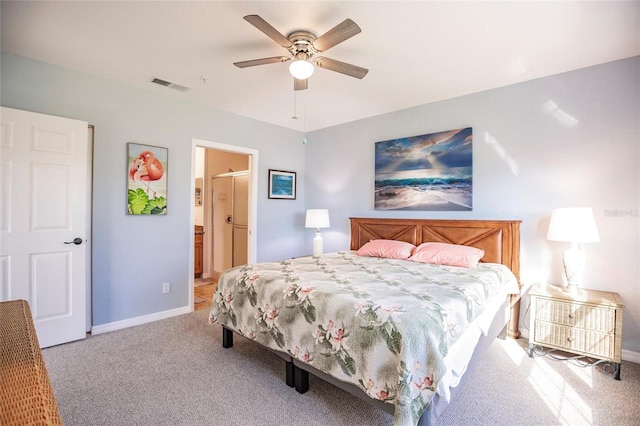 carpeted bedroom with connected bathroom and ceiling fan