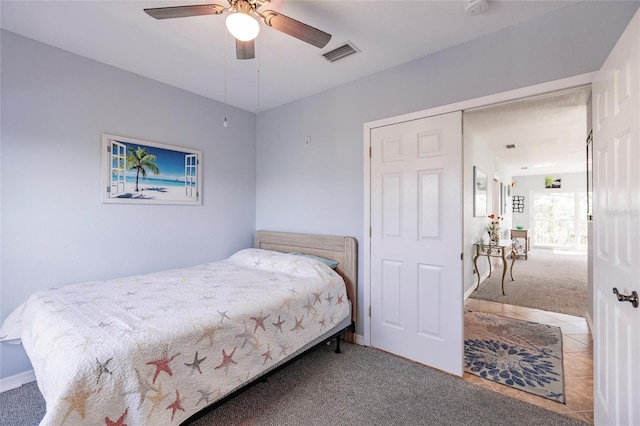 carpeted bedroom with ceiling fan