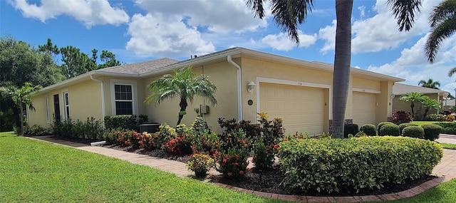 view of property exterior featuring a garage and a lawn