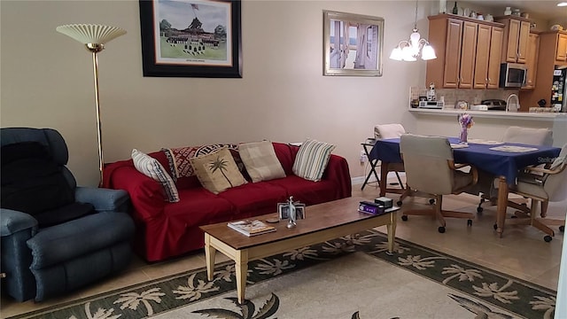 tiled living room with an inviting chandelier and sink