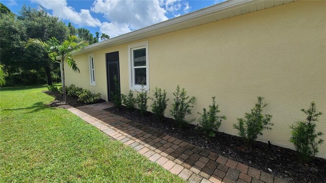 view of home's exterior featuring a yard