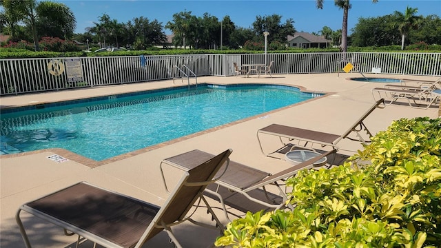 view of swimming pool featuring a patio