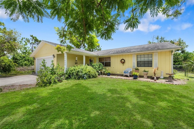 ranch-style home featuring a garage and a front yard