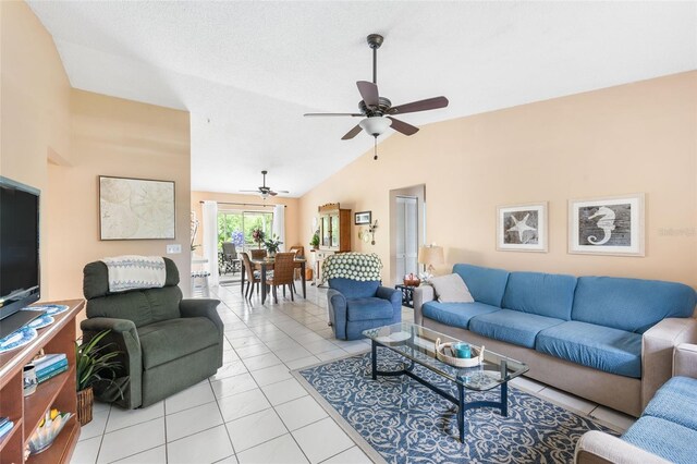 tiled living room with high vaulted ceiling and ceiling fan