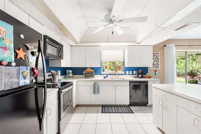 kitchen with sink, black appliances, white cabinets, and ceiling fan