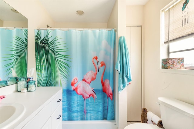 full bathroom with shower / bath combo, toilet, and vanity