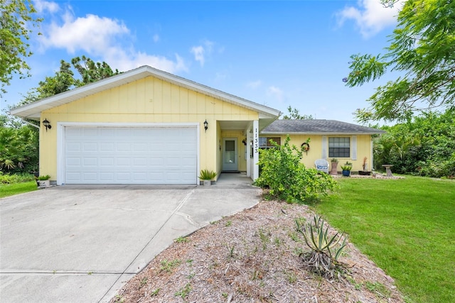 ranch-style home with a garage and a front yard