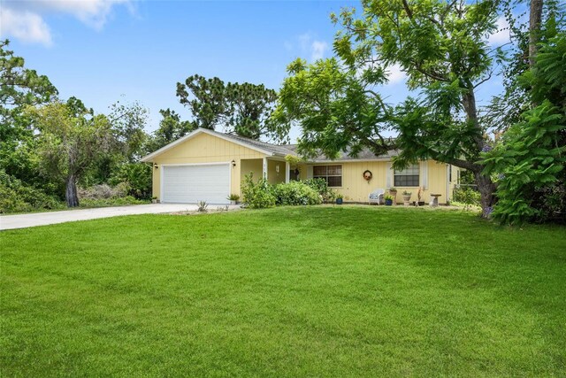 ranch-style house with a garage and a front yard