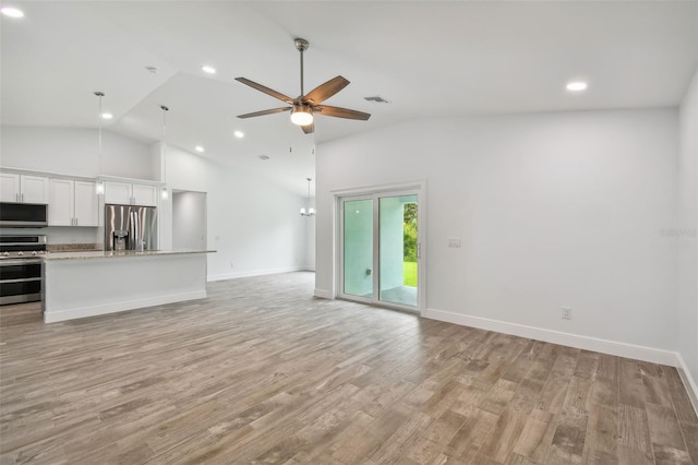 unfurnished living room with high vaulted ceiling, ceiling fan, and light hardwood / wood-style floors