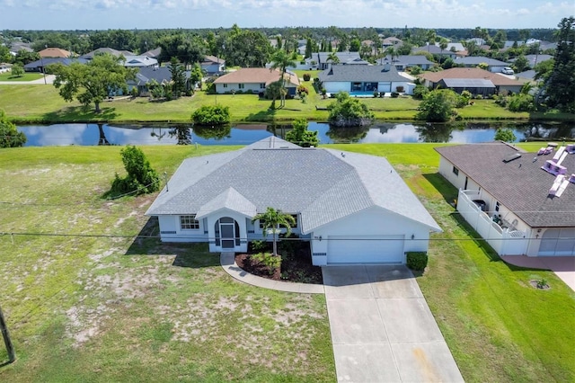 bird's eye view with a water view and a residential view