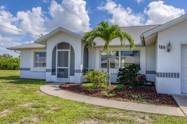 ranch-style house featuring a front yard