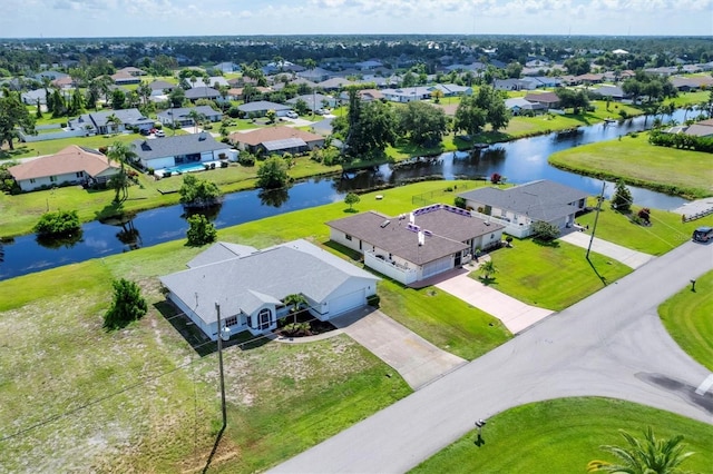 aerial view featuring a residential view and a water view