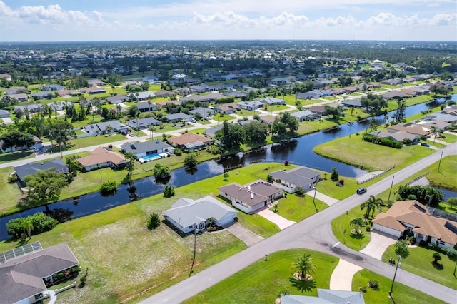 aerial view featuring a residential view and a water view