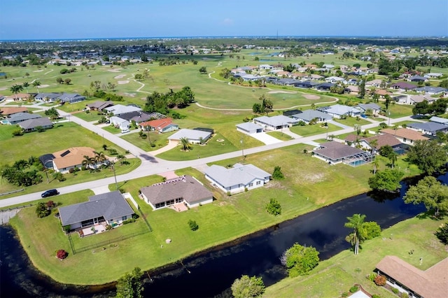 birds eye view of property with a residential view and a water view