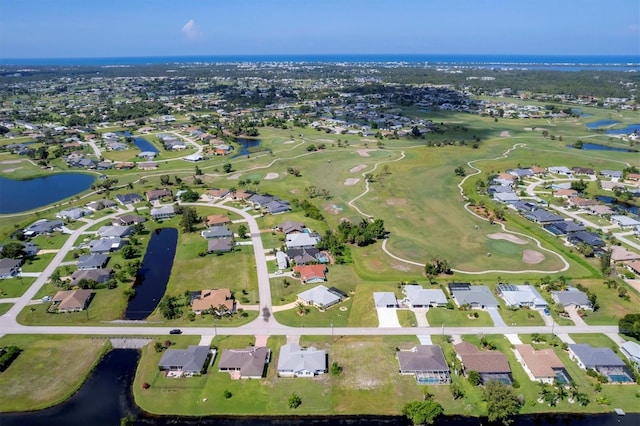 aerial view with a water view, view of golf course, and a residential view