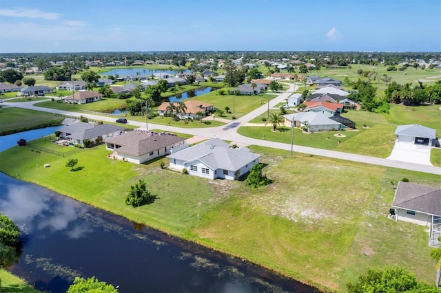 aerial view featuring a water view and a residential view