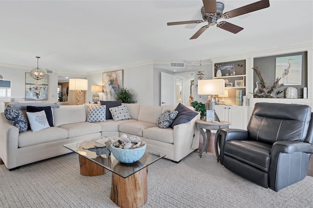 carpeted living area featuring visible vents, crown molding, and ceiling fan with notable chandelier