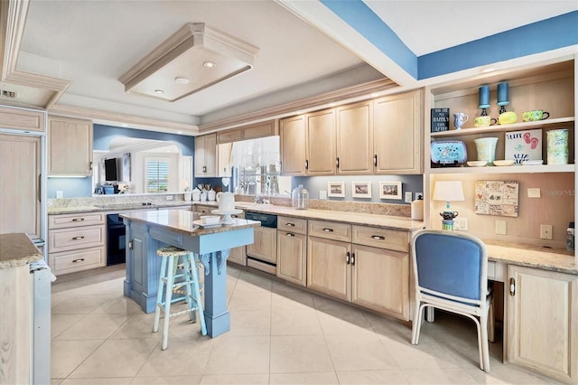 kitchen featuring light tile patterned floors, light brown cabinets, a breakfast bar, a center island, and built in desk