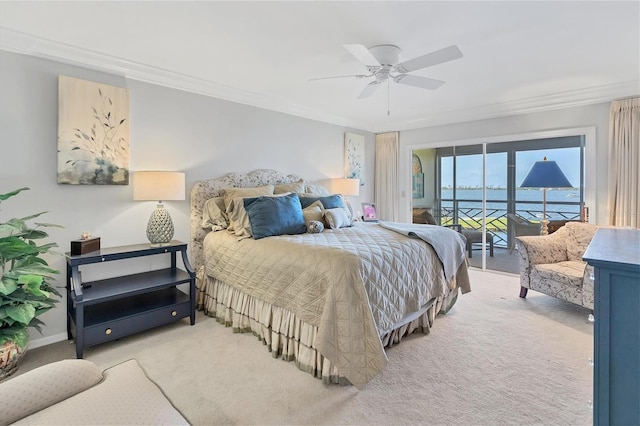 carpeted bedroom with access to exterior, ornamental molding, baseboards, and ceiling fan