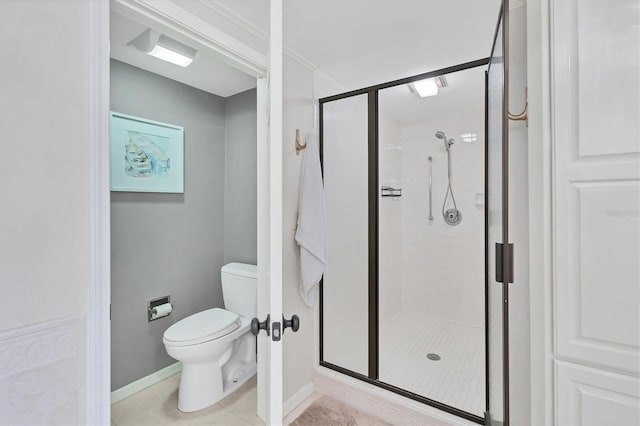 full bath with tile patterned flooring, baseboards, a shower stall, and toilet