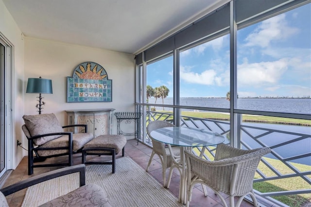 sunroom with a water view