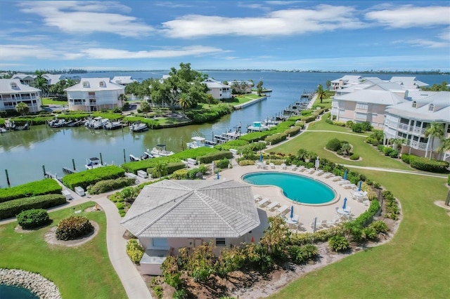 birds eye view of property featuring a water view and a residential view