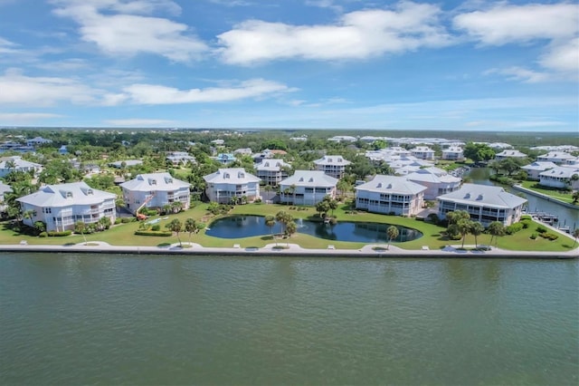 birds eye view of property featuring a water view and a residential view